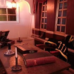 a living room filled with furniture and a large window