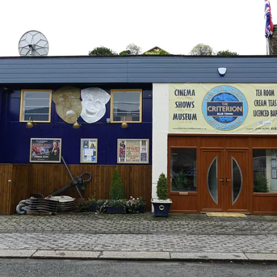 a house that has a sign on the side of a building