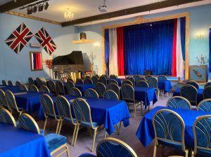 a room filled with furniture and a blue chair