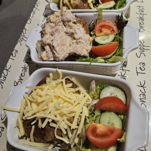 a box filled with different types of food on a table