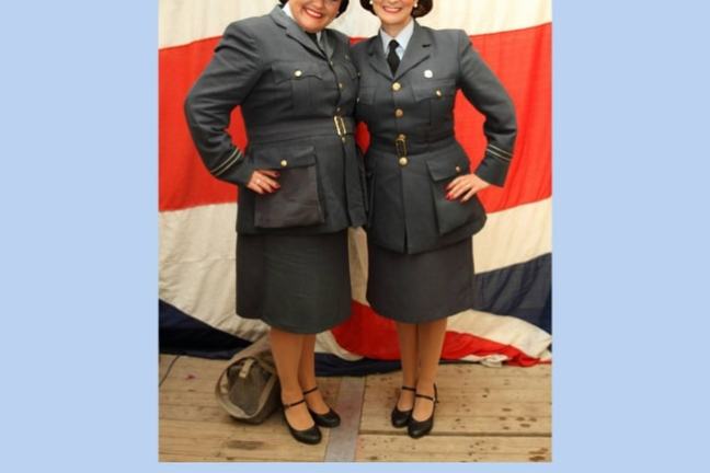 Poster featuring two women in vintage uniforms in front of UK flag with event details for November 11, 2026.