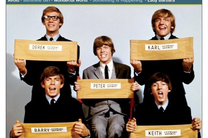 Five young men in suits holding signs with names, smiling, Herman's Hermits album cover.