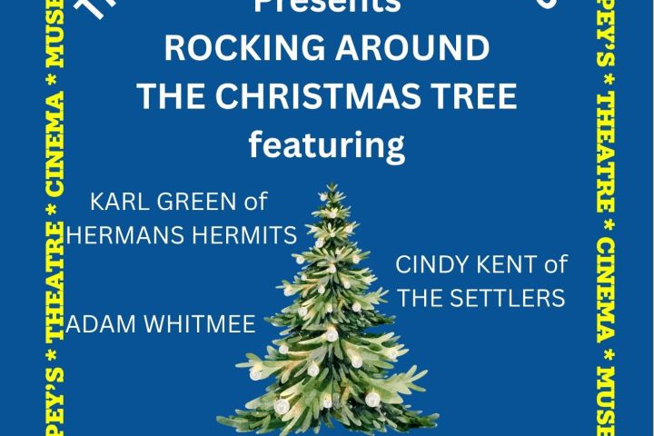 Blue and yellow poster advertising a Christmas concert with a decorated tree image.